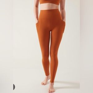 Athleta Salutation stash tight orange